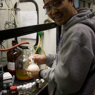 Laboratory Man with Liquid Bottle