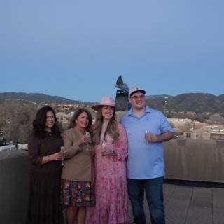 Rooftop Family Portrait with Majestic Mountain Range