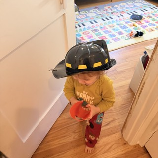 Little Firefighter Ready for Trick-or-Treating at Home