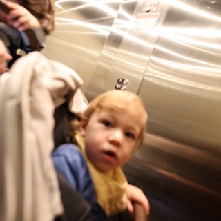 Child in Elevator with Parent - Candid Moment