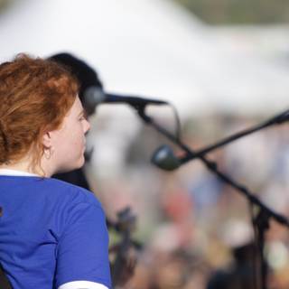Red-Headed Dreadlocked Woman Rocks Out on Guitar at Coachella