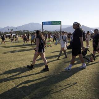 Casual Steps at Coachella 2024: A Sunny Day on the Grass