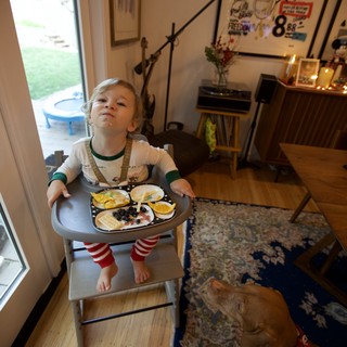 Toddler Proudly Carrying Christmas Eve Dinner Tray