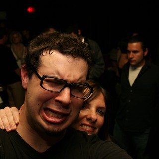 Friends Making Funny Faces at a Nightclub Party