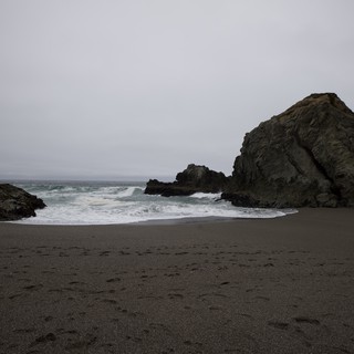 Moody Cove at Dusk with Dark Sand Beach