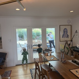 Family Moment Through Glass Doors at Home