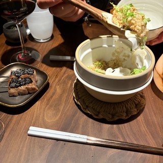 Sharing Asian Rice Dish at Upscale Dining Experience