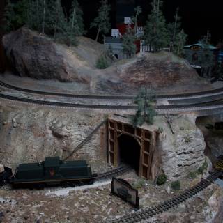 Miniature Train Going Through Tunnel in Diorama