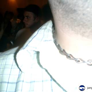 Chain Necklace-wearing Men and Women at Night Club