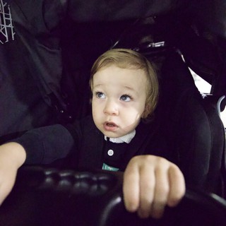 Toddler at Baby Rave Event in Dark Setting