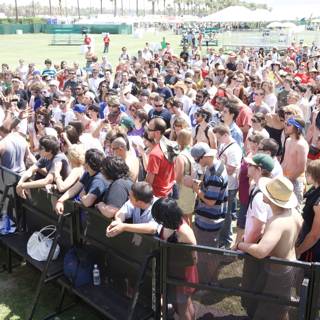 Coachella Crowd Gathers In Front of Fence