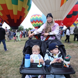 Family Watches Hot Air Balloons at Classic Festival