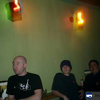 Three Men at the Neon-Lit Bar