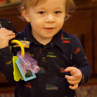 Toddler Playing with Toy Keys at Christmas