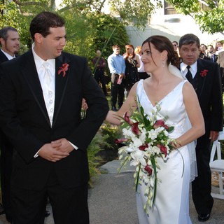 Bride and Groom Share Joyful Moment at Outdoor Wedding