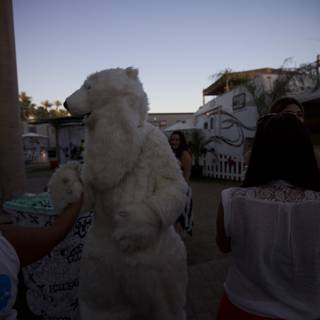 Woman poses with white bear at Coachella