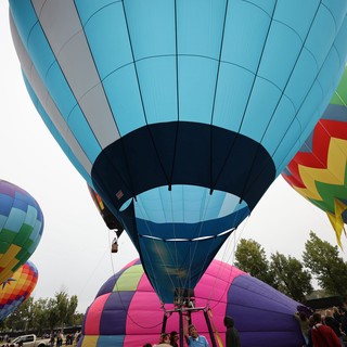 Ground-Level Giants: Hot Air Balloons Ready for Launch