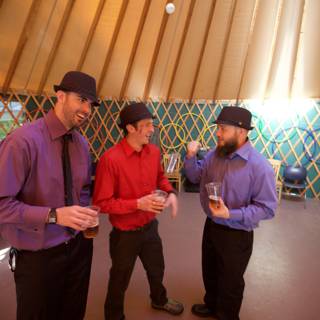 Three Men and Their Hats in the Wedding Reception Room