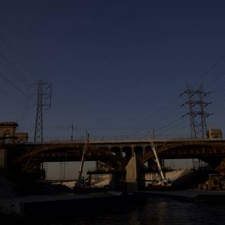 Overpass with Power Lines and Boat on LA River