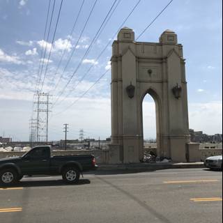 Pickup Truck Driving past Majestic Arch