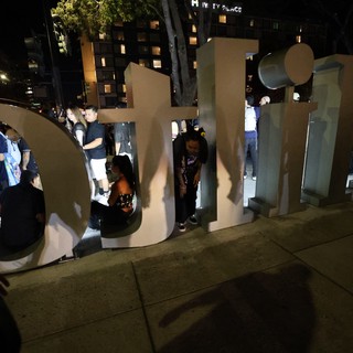 Crowd Gathers Around Giant Letters at Wobbleland Festival
