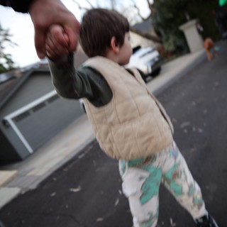 Father and Child Basketball Moment on Suburban Street