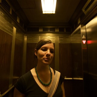 a-vintage-or-historic-building-elevator-likely-in-a-us-city-during-an-art-walk-event-possibly-los-angeles-or-similar-urban-art-district