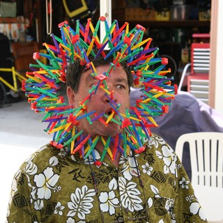 Man Wearing Elaborate K'Nex Toy Construction on Face