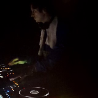 DJ Performance in Darkened London Nightclub