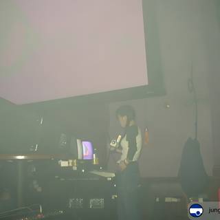 DJ Performing in a Dark Room