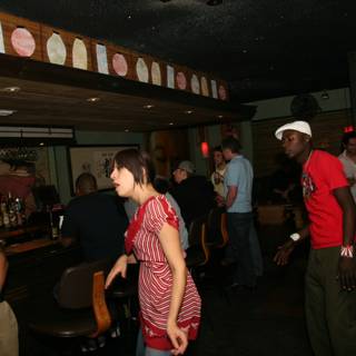 Lady in Red at a Busy Bar