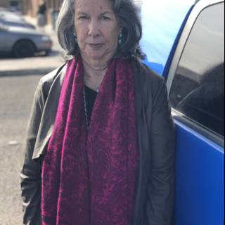 Woman in a Purple Scarf with a Blue Car