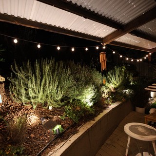 Cozy Illuminated Garden Patio at Night
