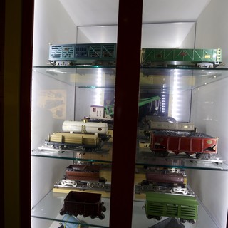 Vintage Model Train Collection Display in Glass Cabinet