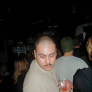 Shaved Head and Mustache Man at the Nightclub