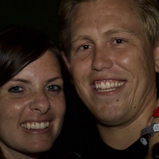 Two Friends Smiling Together at a Night Event