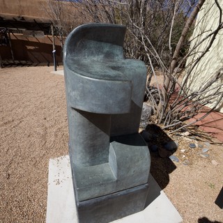 Abstract Bronze Sculpture in Desert Courtyard Setting
