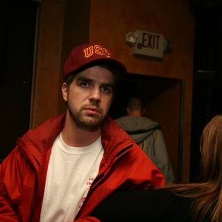 Red Jacket and Baseball Cap at the Pub