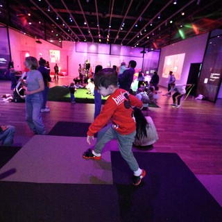 Child Dancing at Baby Rave Interactive Museum Event