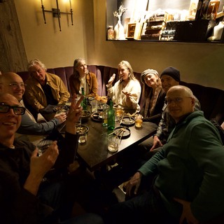 Friends Gathering at Intimate Restaurant Booth