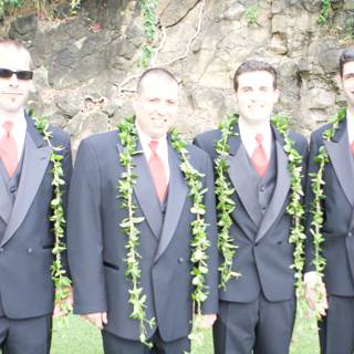 Four Men in Suits Posed Among Flower Arrangements