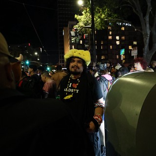 Festival Reveler in Pikachu Hat at Night Celebration