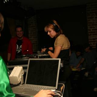 Green Shirted Woman Rocks the DJ Booth