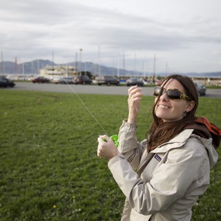 Woman Flying a Kite at San Francisco Waterfront