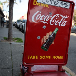 Vintage Coca-Cola Sidewalk Sign with Bullet Holes