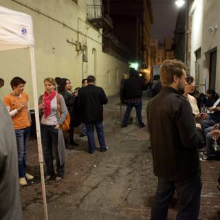 Nighttime Gathering in an Urban Alleyway