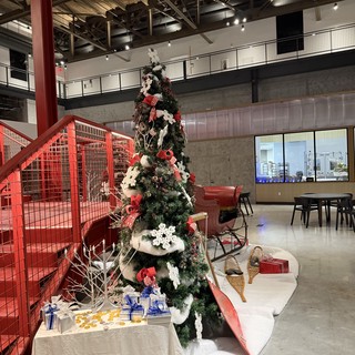 Festive Christmas Tree in Modern Industrial Office Lobby