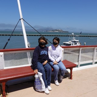 Two Friends Enjoying Waterfront Views Together