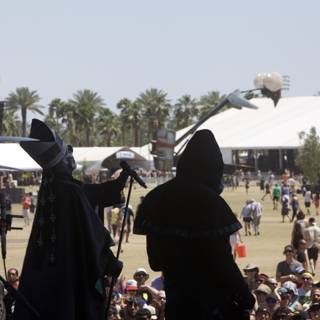 Black Robed Figures Perform on Coachella Stage