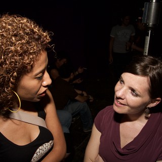 Two Women Sharing a Moment at a Nightclub